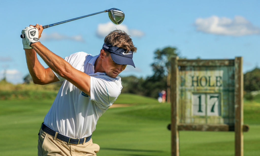 Golfer mid-backswing on hole 17, focusing on form and consistency—ideal representation for “How to Break 90."